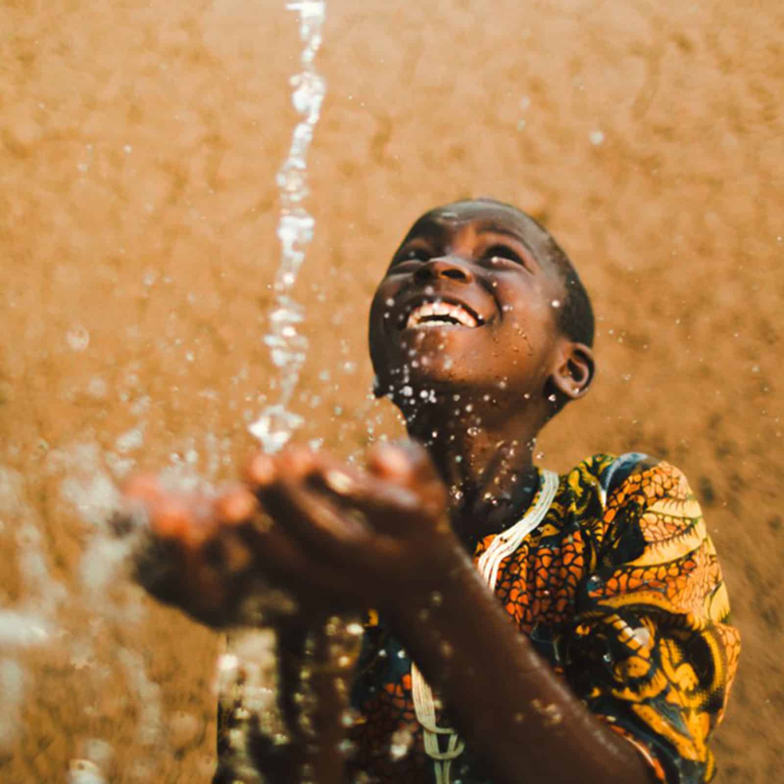 water-new-3 boy smiling with clean drinking water