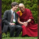 Richie Davison, an expert in mindfulness meditation, sits with the Dalai Lama