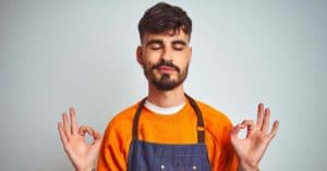 young shopkeeper practicing strong minds meditation