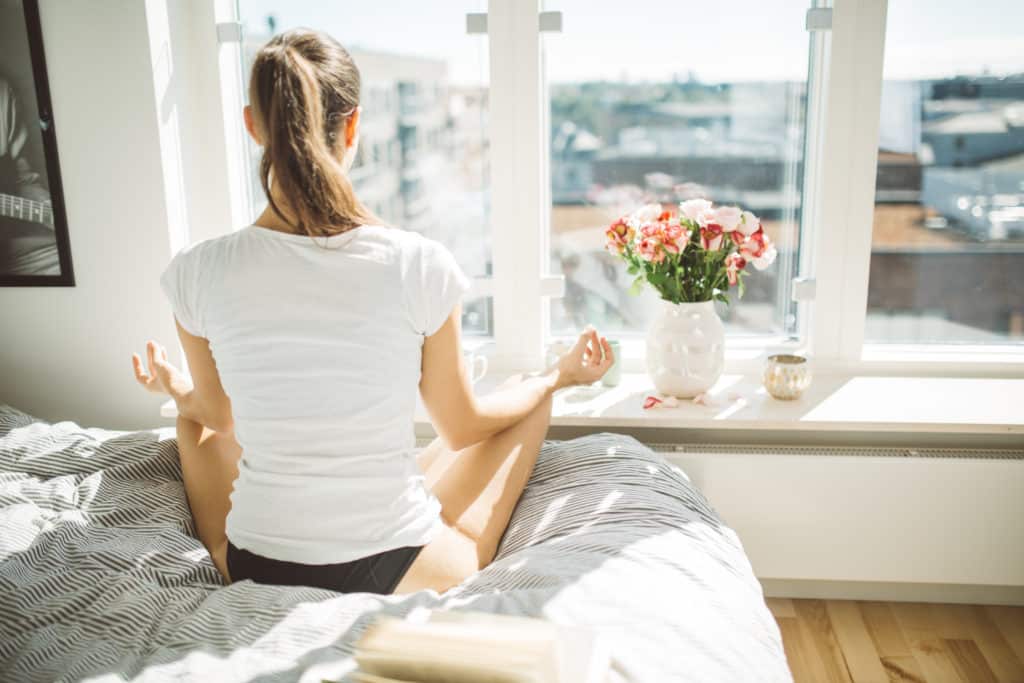 woman practicing meditation habit